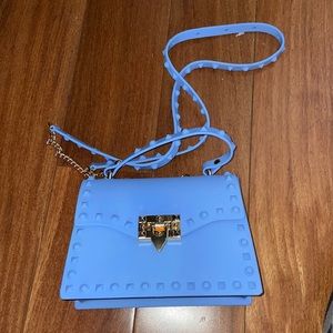 Hey! I am selling a light blue purse